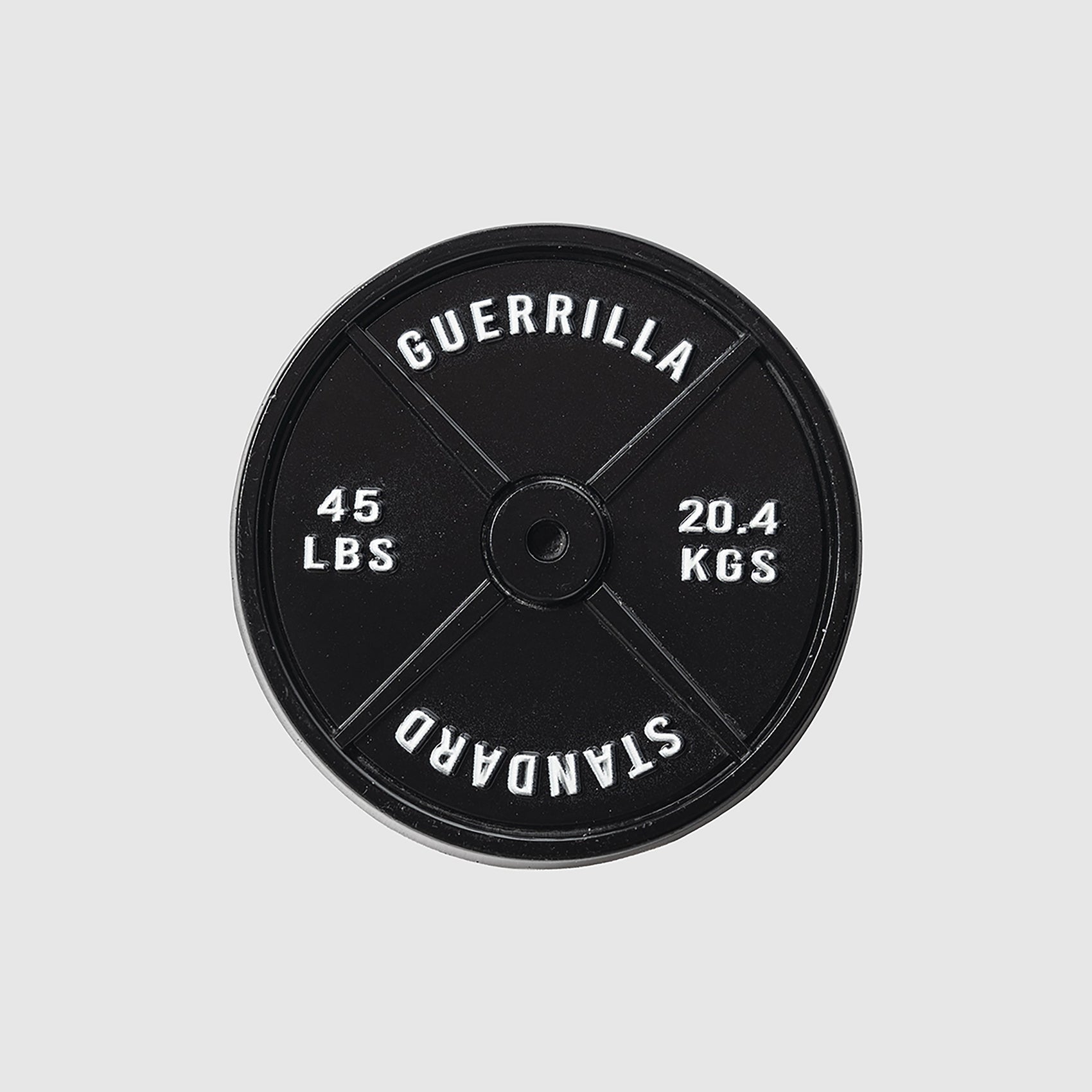 A black 45lb Plate Ball Marker by Guerrilla Golf, featuring "GUERRILLA STANDARD" along with weight markings of 45 LBS and 20.4 KGS in crisp white text against a light gray backdrop—its robust design evokes the industrial strength of a manhole cover.
