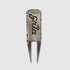 The GRLA Raw Divot Tool by Guerrilla Golf is a sleek metal golf accessory featuring two prongs, with "Erika" engraved on the front alongside the GRLA logo, set against a plain light gray background.