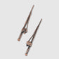Two metal hair sticks inspired by the design of Guerrilla Golf’s Fishing Pole Divot Tool, each featuring intricate hilts and subtle locking mechanisms—displayed diagonally against a simple light background, these stylish accessories are crafted with the same precision as classic golf divot tools, offering an elegant yet unexpected tribute to iconic gear from the Guerrilla Golf collection.