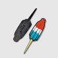 Two enamel pins from Guerrilla Golf: one shaped like the Rocket Pop Divot Tool golf accessory, designed in red, white, and blue to resemble a rocket pop popsicle, and the other showing the black back side with a pin clasp and "hello" engraved.