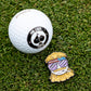 The Dale the Degenerate Ball Marker by Pins and Aces features a colorful cartoon bearded man pin with sunglasses, headband, and cigarette, next to a white golf ball with a spade logo—perfect as fun magnetic ball markers on the green.