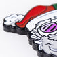 A close-up of the Pins and Aces Santa the Degenerate Ball Marker features a colorful, cartoon Santa design with his red hat, white beard, and a purple detail—perfect as a festive Christmas golf accessory.