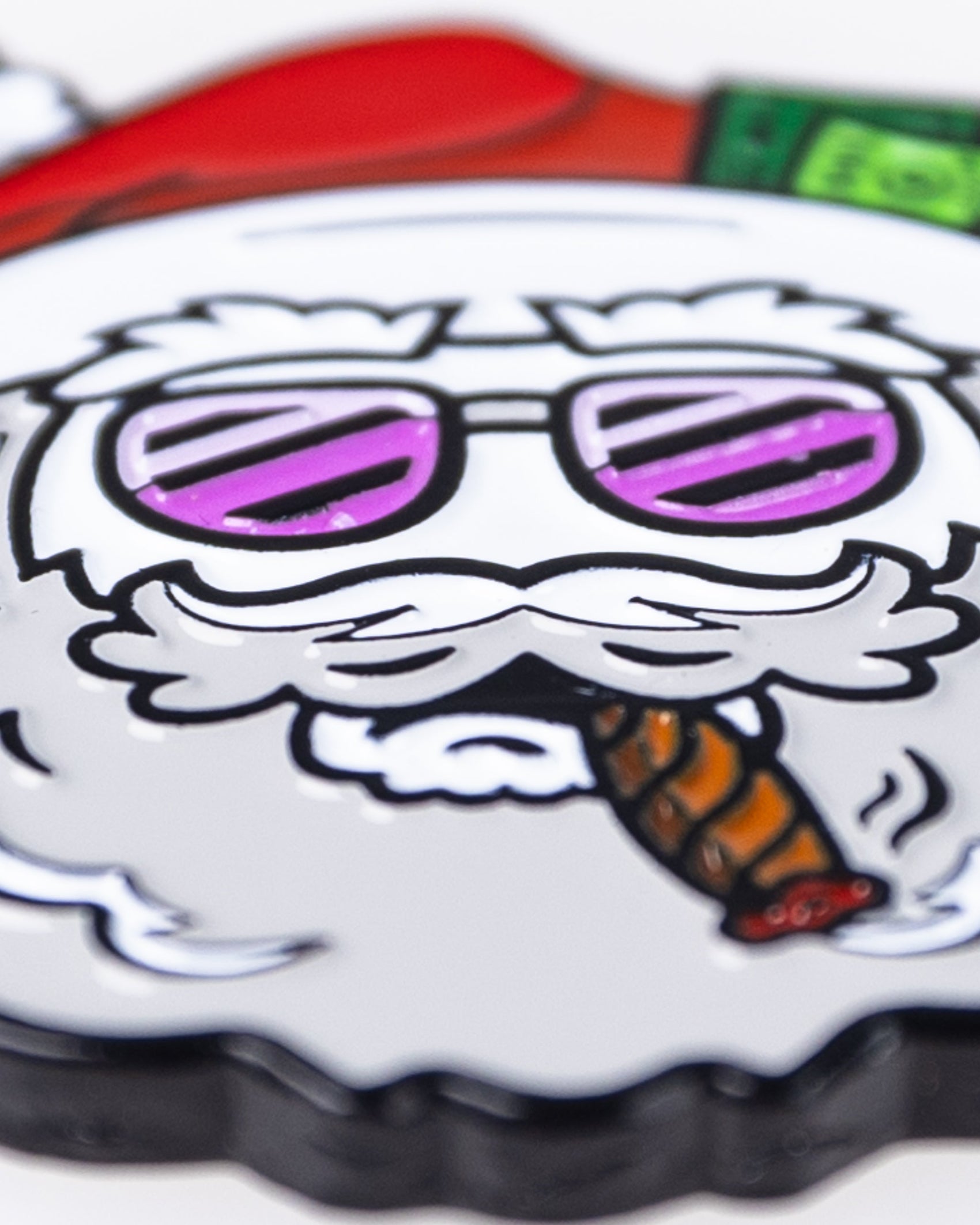The Santa the Degenerate Ball Marker by Pins and Aces features a cartoon Santa with white hair, a beard, purple sunglasses, and a cigar. This magnetic marker makes a fun Christmas golf accessory.