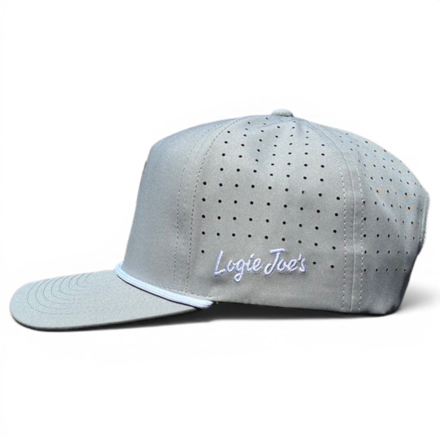 A light gray Alien Caddy Golf Hat by Logie Joe's Golf, featuring an adjustable snapback, built-in magnetic ball marker holder with marker included, and white "Logie Joe's" embroidery on the side panel. Displayed on a white background.