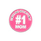 The Evergolf Worlds Greatest #1 Mom badge is a pink circular metal golf marker with white text—an ideal accessory for any golfer looking to celebrate their mom on the course.