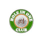 A high-quality metal circular badge featuring a golf ball and “HOLE IN ONE CLUB” text on green—perfect for Evergolf fans and collectors of the Hole In One Club accessory.
