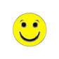The Evergolf Smiley Face - Happy/Sad Ball Marker features a bright yellow face with black eyes, eyebrows, and a big smile on quality metal—an ideal addition to your golf accessories collection.