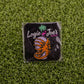 Face Hugger by Ballmarkers from Logie Joe’s is a small pin and premium ball marker featuring a mummy with a “Free Hugs” sign on grass. Packaged with Logie Joe’s branding, it adds fun and uniqueness to your golf gear.