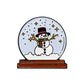 The Frosty the Snow Globe Ball Marker by Ballmarkers.com features a cartoon snowman with a top hat and scarf inside a dome with falling snow and yellow stars, all set atop a brown base.