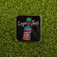 A square sticker on green turf featuring Ballmarkers by Logie Joes Chunky Peanut Butter text, a pink flamingo, palm tree, and a peanut butter jar—ideal for fans of novelty and golf ball markers.