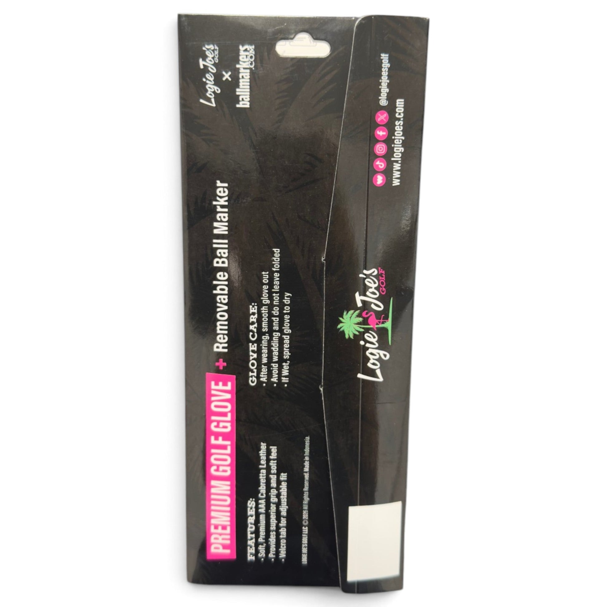 Black retail packaging for the Logie Joe’s Golf Transfusion Cabretta Leather Golf Glove, a premium golf glove available in left and right hand, standard and cadet sizes, featuring a magnetic ball marker. The packaging highlights features and care instructions in the text. A palm tree logo is displayed on the front, while the website and social media icons are shown on the side.