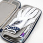 A close-up of the Pins and Aces Glove & Accessory Caddie - Navy shows it open with neatly stacked golf gloves, including a white glove with a blue star-patterned strap, displayed on a white background.