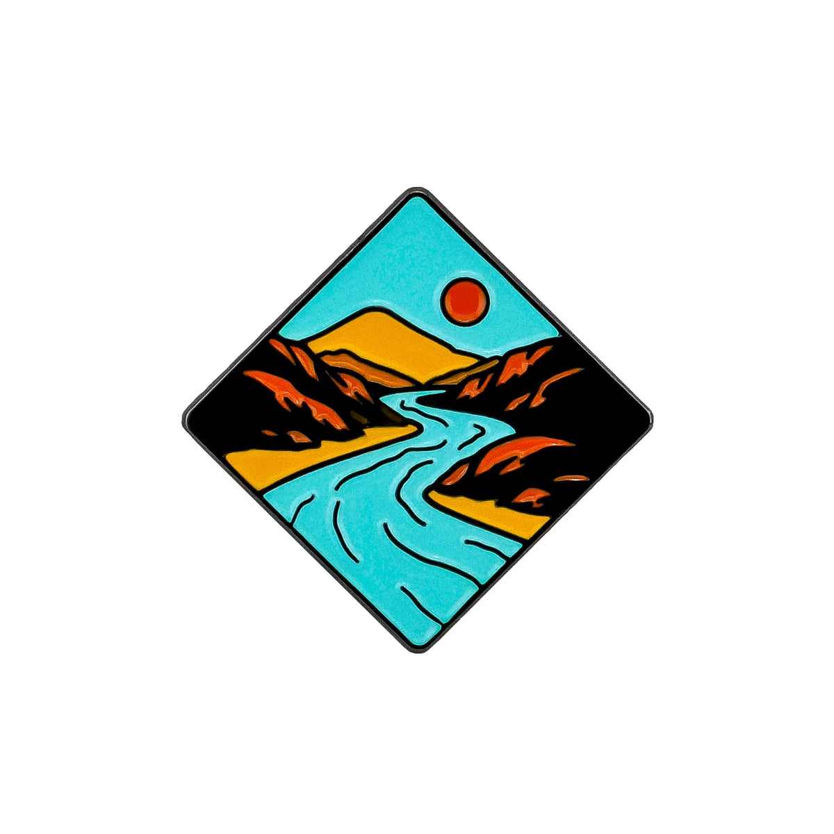 The Grand Canyon Ball Marker by Ballmarkers.com features a diamond-shaped design with a blue river winding through orange hills beneath a red sun and blue sky, inspired by Southwestern golf accessories.