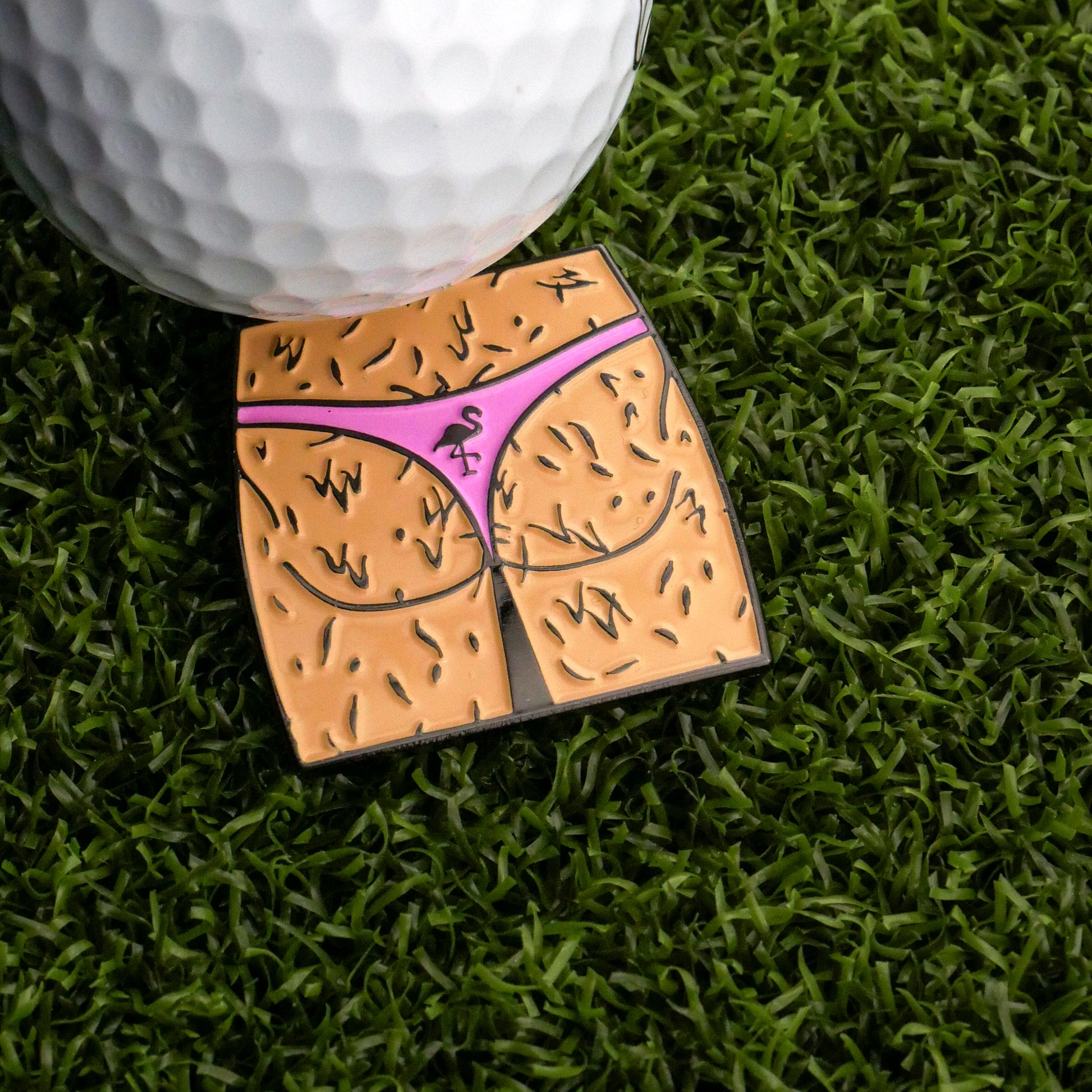 Bring laughs to the course with Logie Joe's Golf Hairy Thong Ball Marker—a cheeky marker shaped like a lower half in a pink bikini with visible hair, perfect for adding fun to your game.