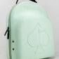 The Pins and Aces Hat Caddie is a light green hat case with handle, zipper closure, and two grommet holes. An embossed spade with flag and "PINS & ACES" decorates the front—perfect for carrying hats on or off the course.