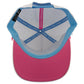 The inside of the Sugar Rush Golf Hat by Logie Joe's Golf features a pink brim, blue sweatband, white mesh panels, and blue Legacy Hats taping. An adjustable fit ensures comfort, and "MAKE YOUR MARK" is printed on the inner crown. Includes a ball marker holder + marker.