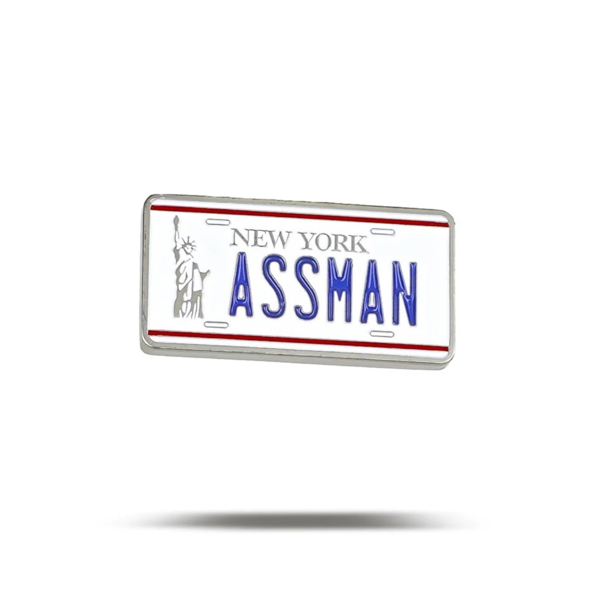 The Bogey Bros "Assman" novelty pin features a New York license plate design with "ASSMAN" in bold blue letters and a small Statue of Liberty—perfect for proctologists, colorectal specialists, or anyone who loves a good laugh.