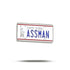 The Bogey Bros "Assman" novelty pin features a New York license plate design with "ASSMAN" in bold blue letters and a small Statue of Liberty—perfect for proctologists, colorectal specialists, or anyone who loves a good laugh.