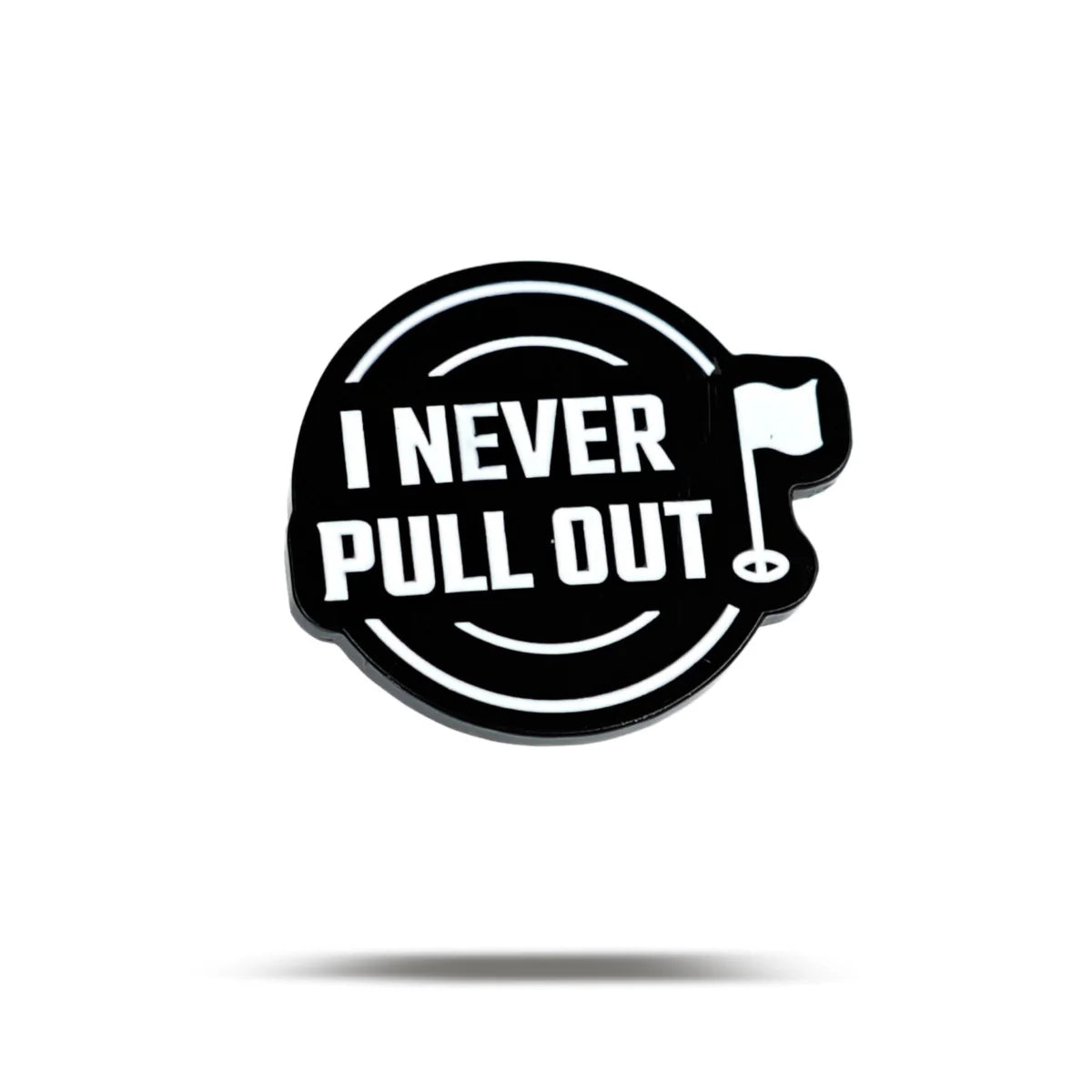 The Bogey Bros "I Never Pull Out" golf marker is circular and black, featuring white text with a small flagstick graphic—ideal for golfers who leave the flag in while putting. Displayed on white with a drop shadow.