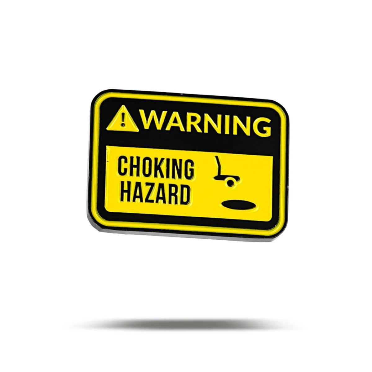 A rectangular yellow and black Bogey Bros Choking Hazard sign features "WARNING CHOKING HAZARD" and a small object icon by a mouth, reminding you that even small items—or pressure putts—can create high-stakes moments.
