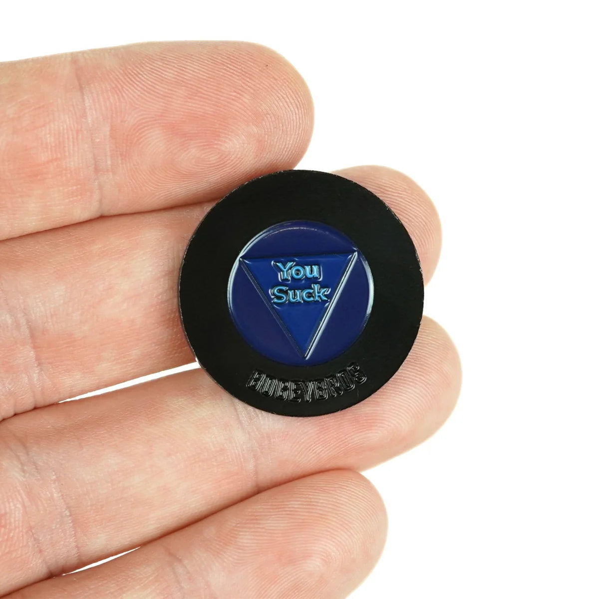 A hand holds the round black and blue Magic 8 Ball by Bogey Bros—an ideal novelty gift or gag toy for anyone who enjoys tongue-in-cheek humor.