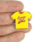 A hand holds a Bogey Bros "Average Joes" enamel pin shaped like a yellow T-shirt with red accents—ideal for any dodgeball fan who loves the classic motto, “If you can dodge a wrench, you can dodge a ball.”.