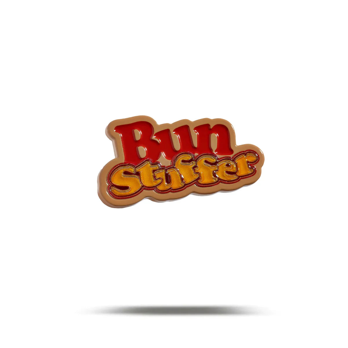 Bogey Bros’ Bun Stuffer pin features bold, retro red and yellow lettering with a shadow on white—an eye-catching accessory for bun lovers and fans of nostalgic style.