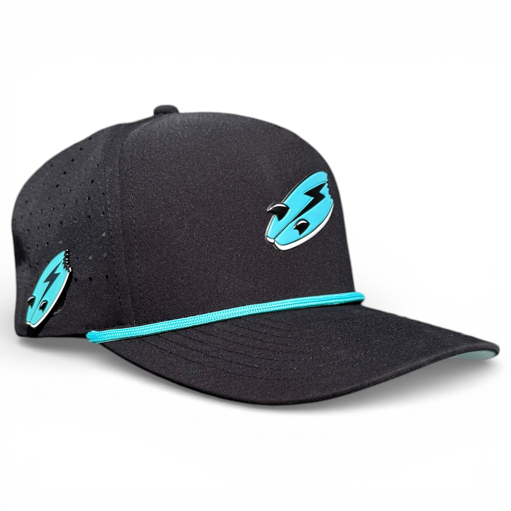 The Logie Joe's Golf Shark Bite Golf Hat is a black snapback cap with turquoise accents and a lightning bolt pin, featuring ventilation holes, an adjustable fit, magnetic ball marker holder, and included marker.