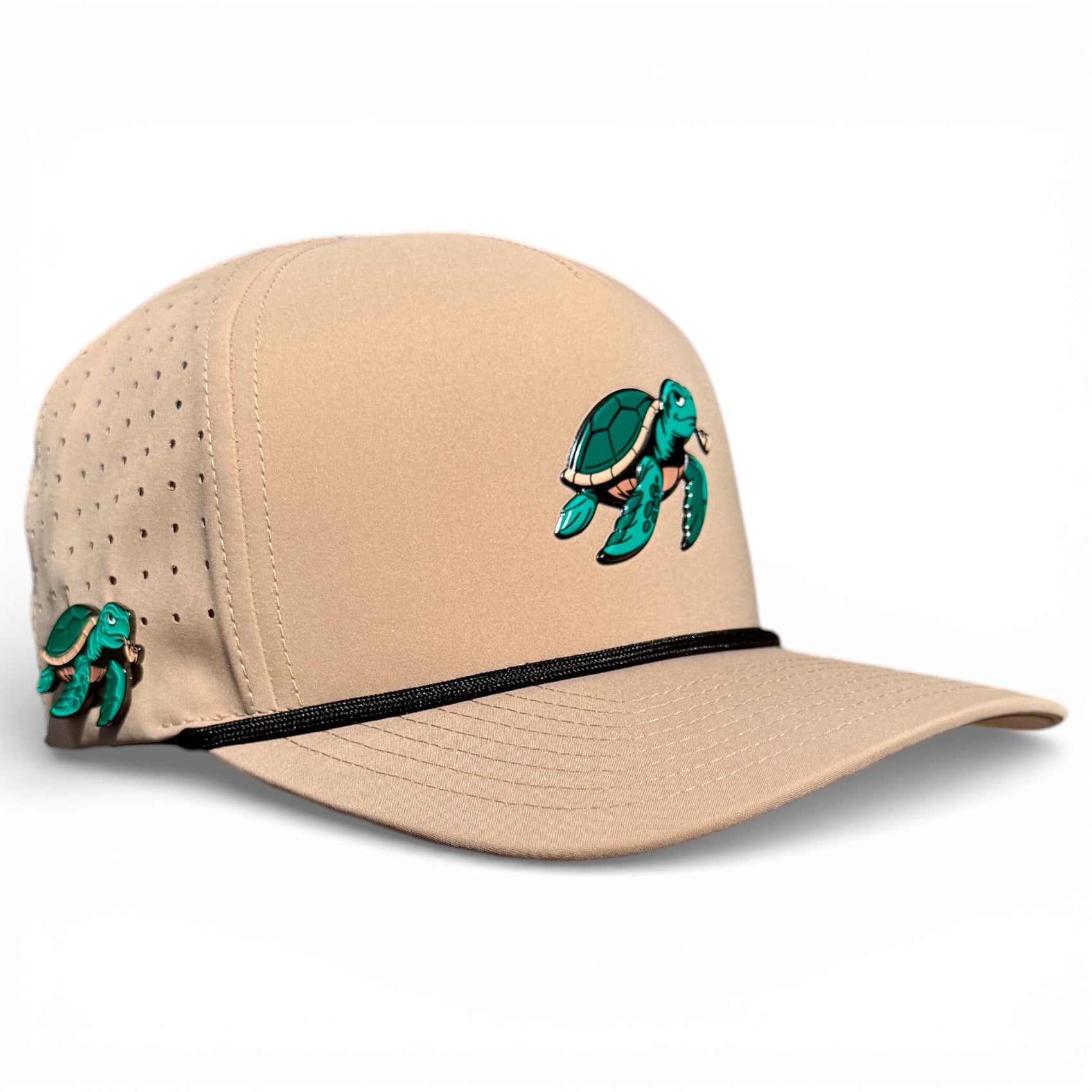 The Logie Joe's Golf Salty Turtle Golf Hat is a beige snapback cap with a green sea turtle on the front, built-in magnetic ball marker holder with marker, ventilation holes, black cord accent, and adjustable one-size fit.