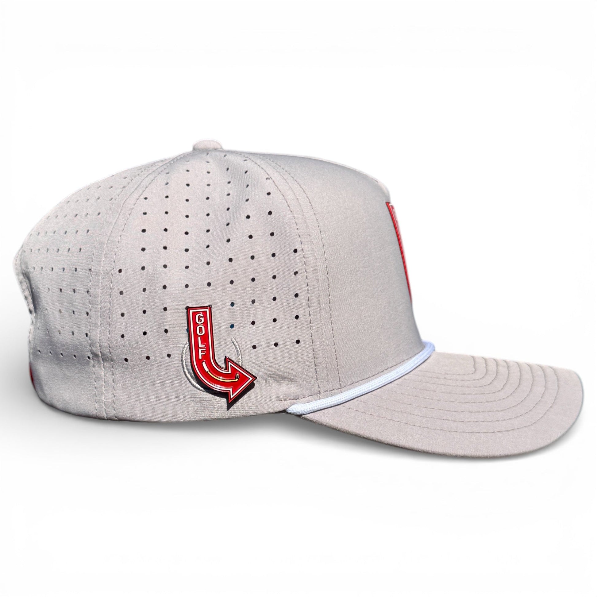 Logie Joe's Golf Neon Arrow Sign Snapback Cap in light gray with ventilation holes, white trimmed brim, and included magnetic ball marker. Features a red and yellow arrow-shaped pin. Adjustable fit. Plain white background.