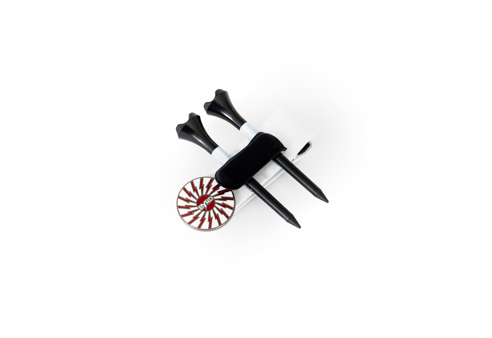 Two black free tees and a circular red and white ball marker are secured by a black and white The Byrd, LLC CLYP in the White Swan design, displayed against a white background.
