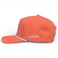 The Logie Joe's Golf Just Peachy Snapback Hat features a peach color, white piping, side-embroidered logo, ventilation holes, and a built-in magnetic ball marker holder with marker. Shown from the side on a white background.