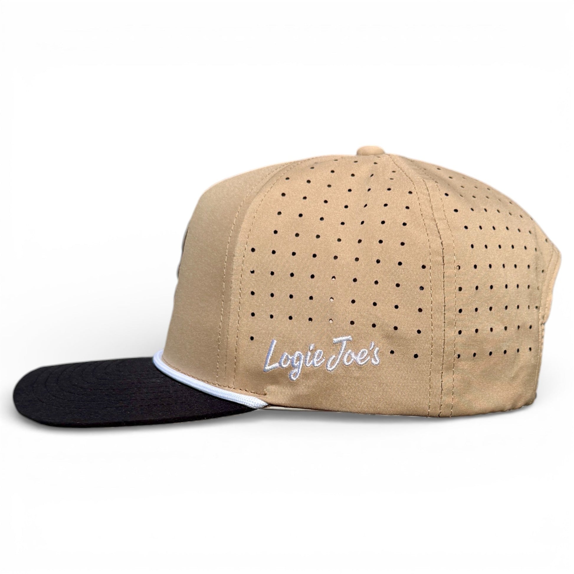 Logie Joe's Golf Hunting Birdies Snapback Cap features a tan crown, black bill, white trim, side ventilation holes, and "Logie Joes" embroidered in white. Includes built-in magnetic ball marker holder with marker. Adjustable fit. Plain white background.