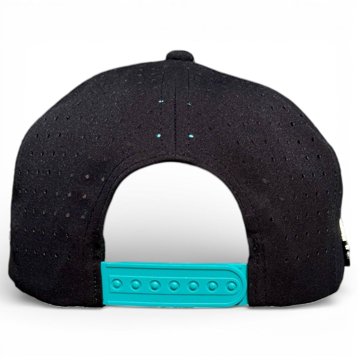 The image displays the back of the Logie Joe's Golf Shark Bite Golf Hat, a black snapback cap with teal adjustable strap and ventilation holes. It features a built-in magnetic ball marker holder with marker included, set against a white background.