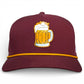 The Logie Joe's Golf Cold One Snapback Cap is a maroon adjustable hat with a yellow-gold cord, an embroidered beer mug patch, and includes a built-in magnetic ball marker holder and marker. Shown on a plain white background.