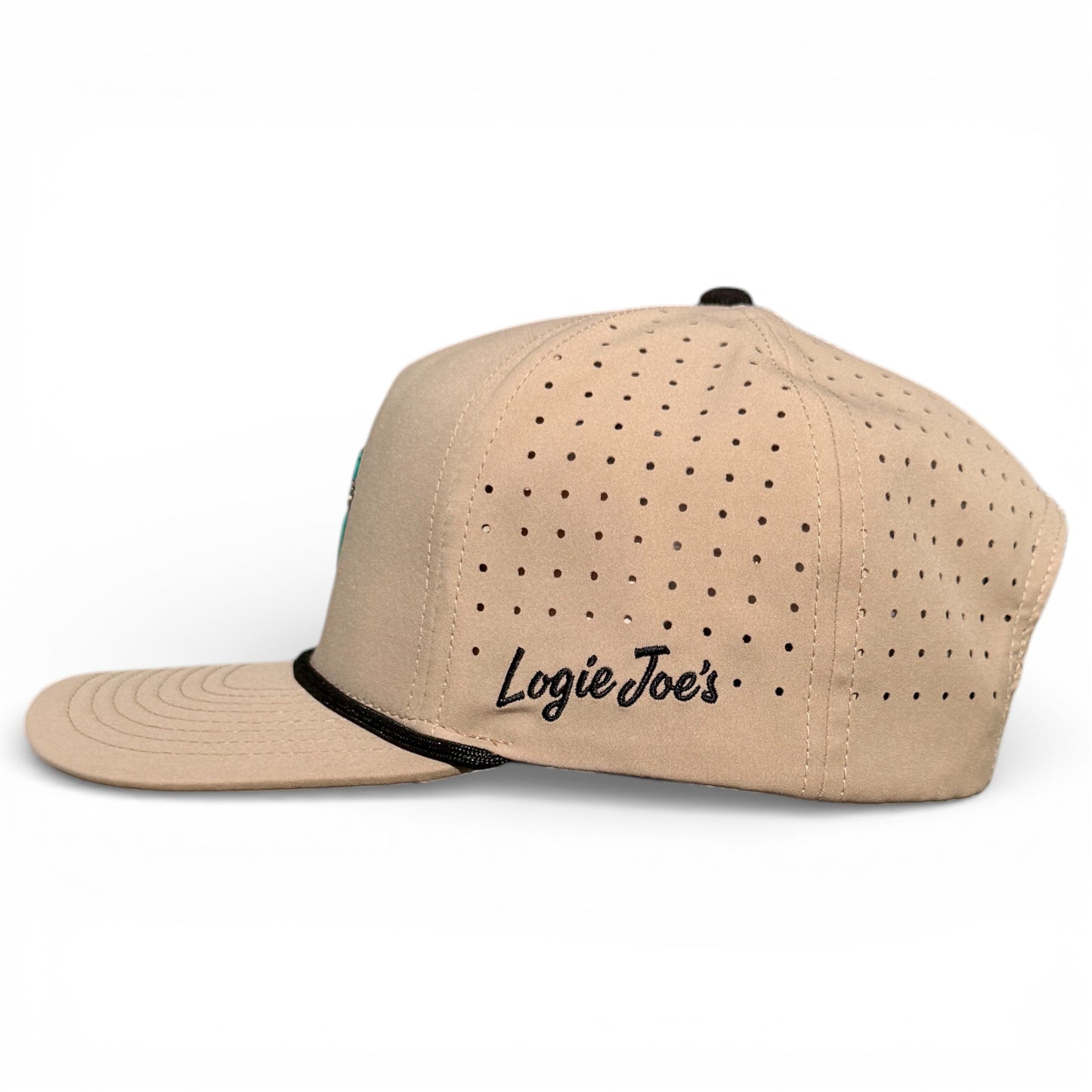 The Salty Turtle Golf Hat by Logie Joe's Golf is a beige snapback cap with side ventilation holes and black embroidered branding above the ear, shown from the side on a white background. Includes built-in magnetic ball marker holder and marker.