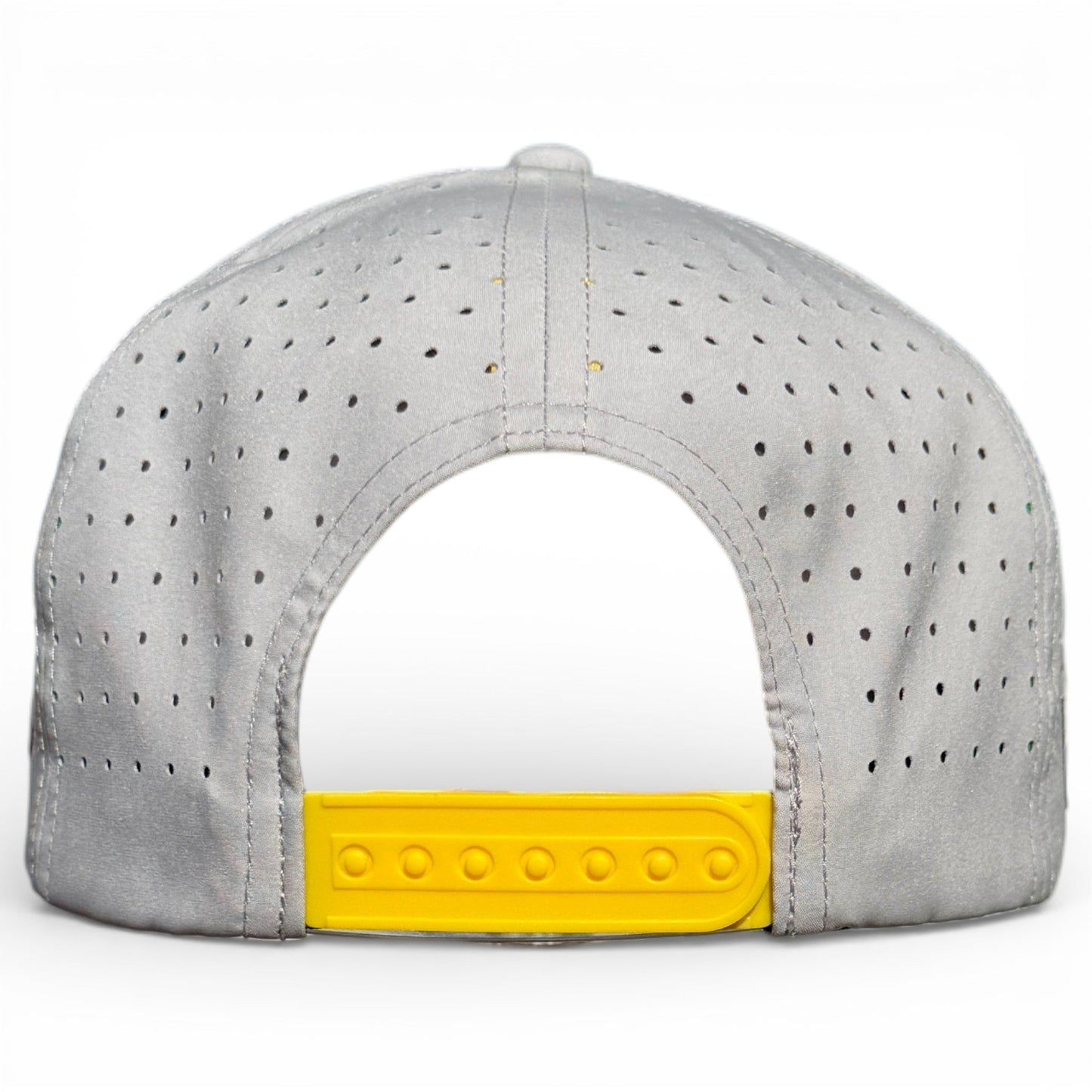 The image shows the back of Logie Joe's Golf Banana Hammock Snapback Cap in light gray with a yellow adjustable closure, featuring a built-in magnetic ball marker holder and included marker—perfect for golfers.