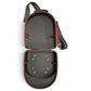 The Logie Joe’s Golf Hat Caddy Travel Case, a hard-shell black and red oval carrier by Logie Joe’s Golf, is open to reveal elastic straps on the top section and metal grommets in the bottom. The adjustable shoulder strap is attached, making this protective hat storage case ideal for carrying up to 6 hats.