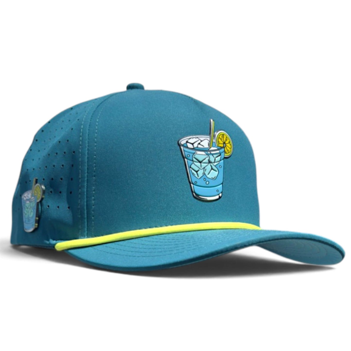 Introducing the Water Hazard Golf Hat by Logie Joe’s Golf—a teal snapback cap with a yellow brim stripe, featuring a playful graphic of a blue iced drink with lemon and straw on the front and a coordinating mini drink motif on the side. Designed for both style and function, this adjustable hat includes a built-in magnetic ball marker holder (plus marker), making it perfect for days on or off the course.