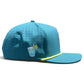 Introducing the Water Hazard Golf Hat from Logie Joe’s Golf—a blue snapback cap with a yellow trim, featuring a small embroidered patch of a refreshing drink with ice, straw, and lemon slice on the side. This stylish golf hat offers breathable perforations for comfort, an adjustable fit, and comes equipped with a built-in magnetic ball marker holder (plus marker included) to enhance your game.