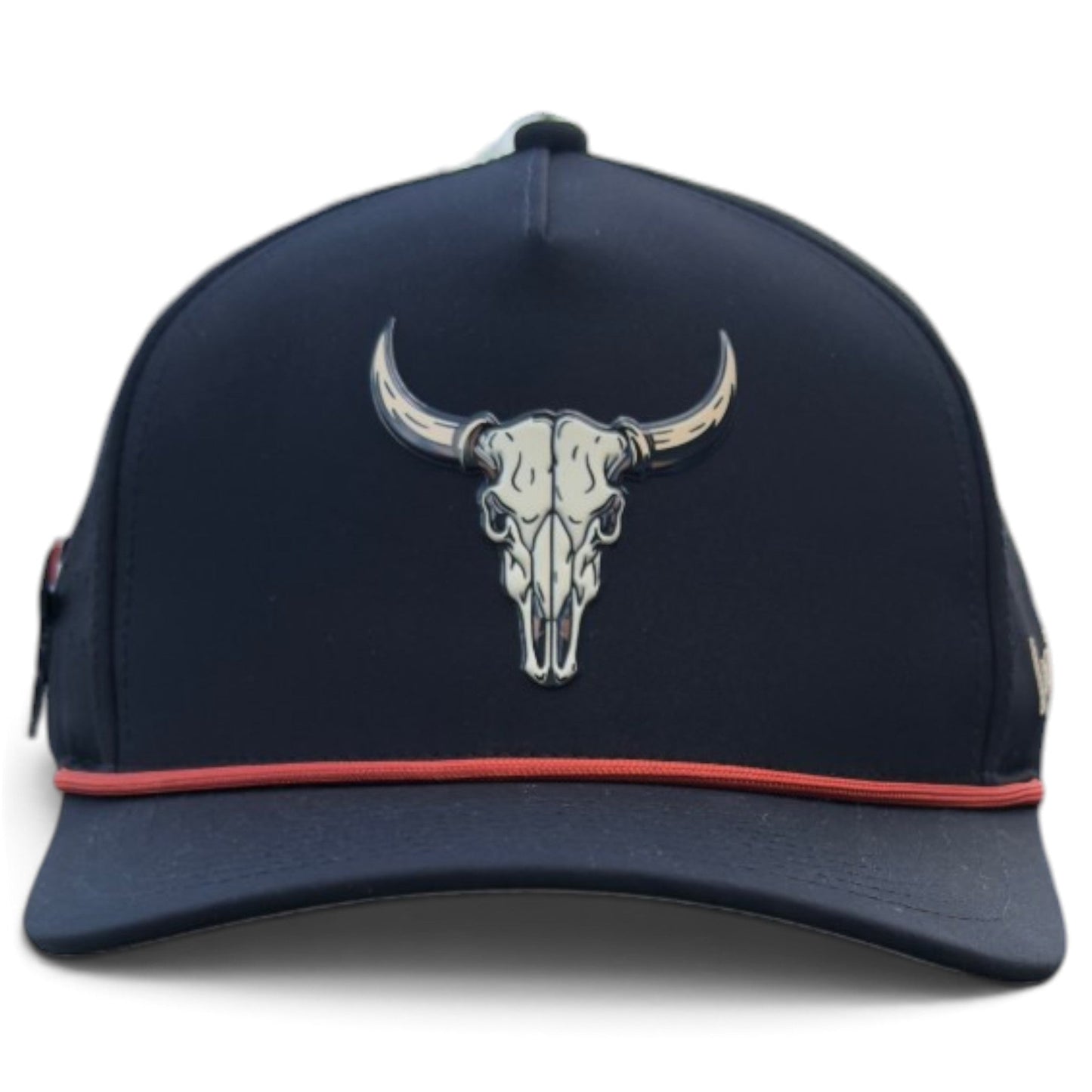 Introducing the Outlaw Golf Hat by Logie Joe’s Golf—a snapback cap in navy blue, featuring a bold bull skull graphic on the front and a sleek red trim above the brim. This adjustable hat is designed for golf enthusiasts with its convenient built-in magnetic ball marker holder, complete with an included marker, ensuring all-day comfort and style on the course.
