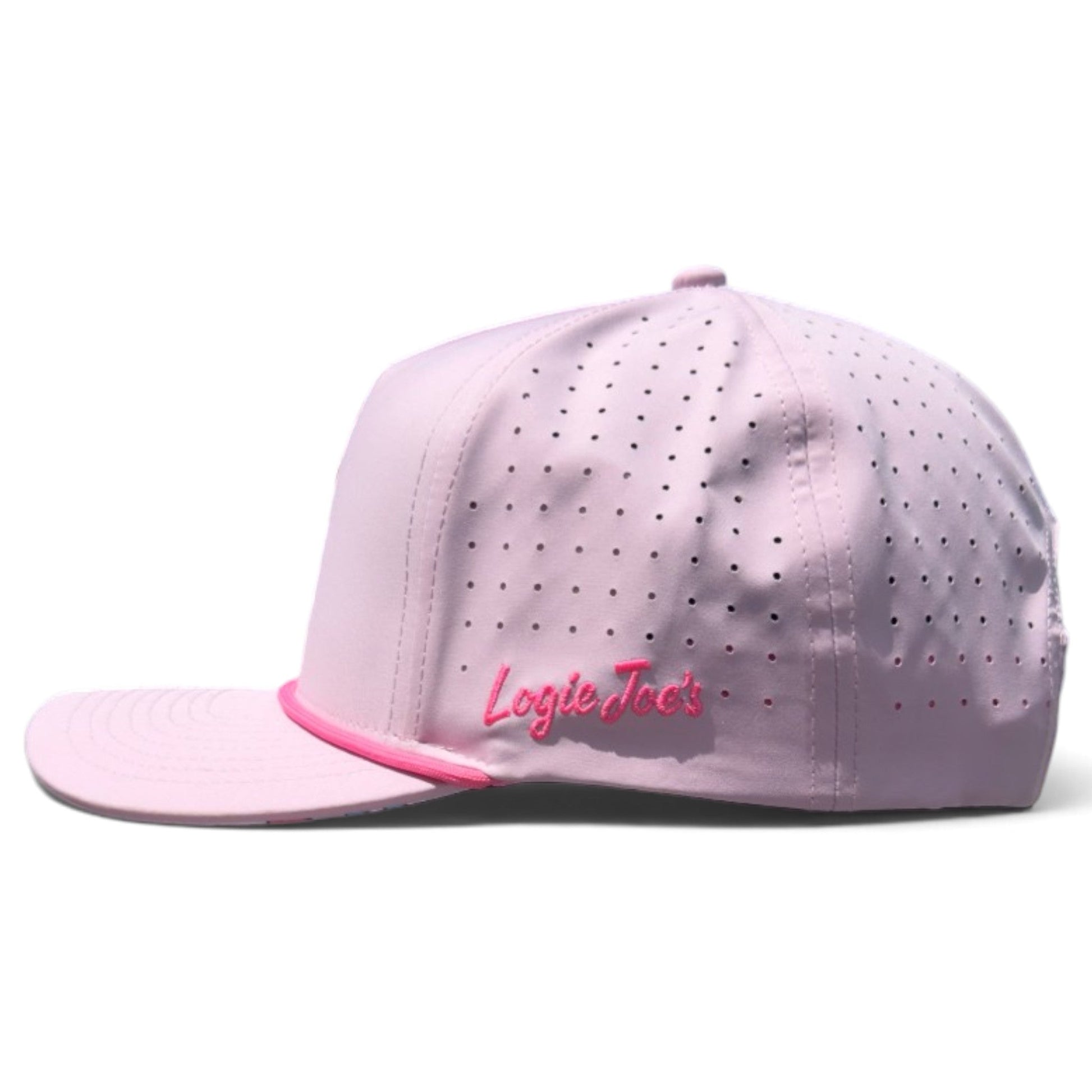 Experience classic style with the Aerobic Angel Golf Hat by Logie Joe’s Golf. This light pink retro snapback cap features small ventilation holes, a curved brim, and an adjustable fit. The side above the brim is embroidered with “Logie Joe’s” in pink script. Designed for versatility, it also includes a built-in magnetic ball marker holder and a marker—perfect for golf or yoga sessions.