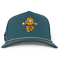 Introducing the Deep Dive Golf Hat from Logie Joe’s Golf—a teal snapback cap featuring an illustration of a vintage deep-sea diver in a yellow diving suit on the front. This adjustable hat comes equipped with a built-in magnetic ball marker holder and includes a marker for added convenience on the course.