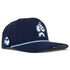 Introducing the Zero Chill Yeti Golf Hat by Logie Joe’s Golf—a navy snapback cap featuring a white and blue abominable snowman graphic on the front, a smaller yeti head on the side, blue patterned rope across the brim, and perforated sides for breathability. With an adjustable fit, built-in magnetic ball marker holder (plus marker included), this golf hat is designed for all-day comfort both on and off the course.