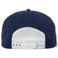 The Zero Chill Yeti Golf Hat by Logie Joe’s Golf is shown from the back in navy blue, featuring a white plastic adjustable snapback closure and perforated panels for breathability—a comfortable, on-course snapback cap with a built-in magnetic ball marker holder (marker included) and Abominable Snowman design.