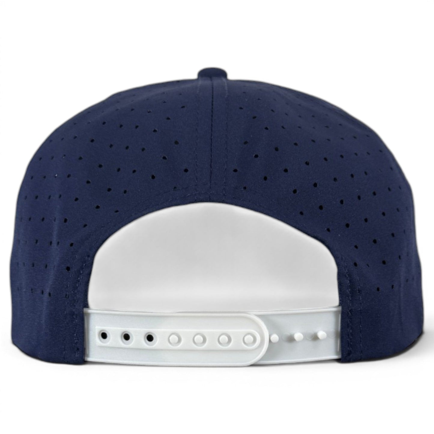 The Zero Chill Yeti Golf Hat by Logie Joe’s Golf is shown from the back in navy blue, featuring a white plastic adjustable snapback closure and perforated panels for breathability—a comfortable, on-course snapback cap with a built-in magnetic ball marker holder (marker included) and Abominable Snowman design.