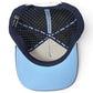 Blue Zero Chill Yeti Golf Hat by Logie Joe’s Golf shown from above, revealing the interior. This breathable snapback cap features a black lining with white polka dots, navy blue trim labeled “Loyal to Few,” and a light blue brim. The inner band displays the words “MAKE YOUR MARK.” Inspired by performance-driven designs, this adjustable hat also includes a built-in magnetic ball marker holder with marker included—perfect for convenience on the course.