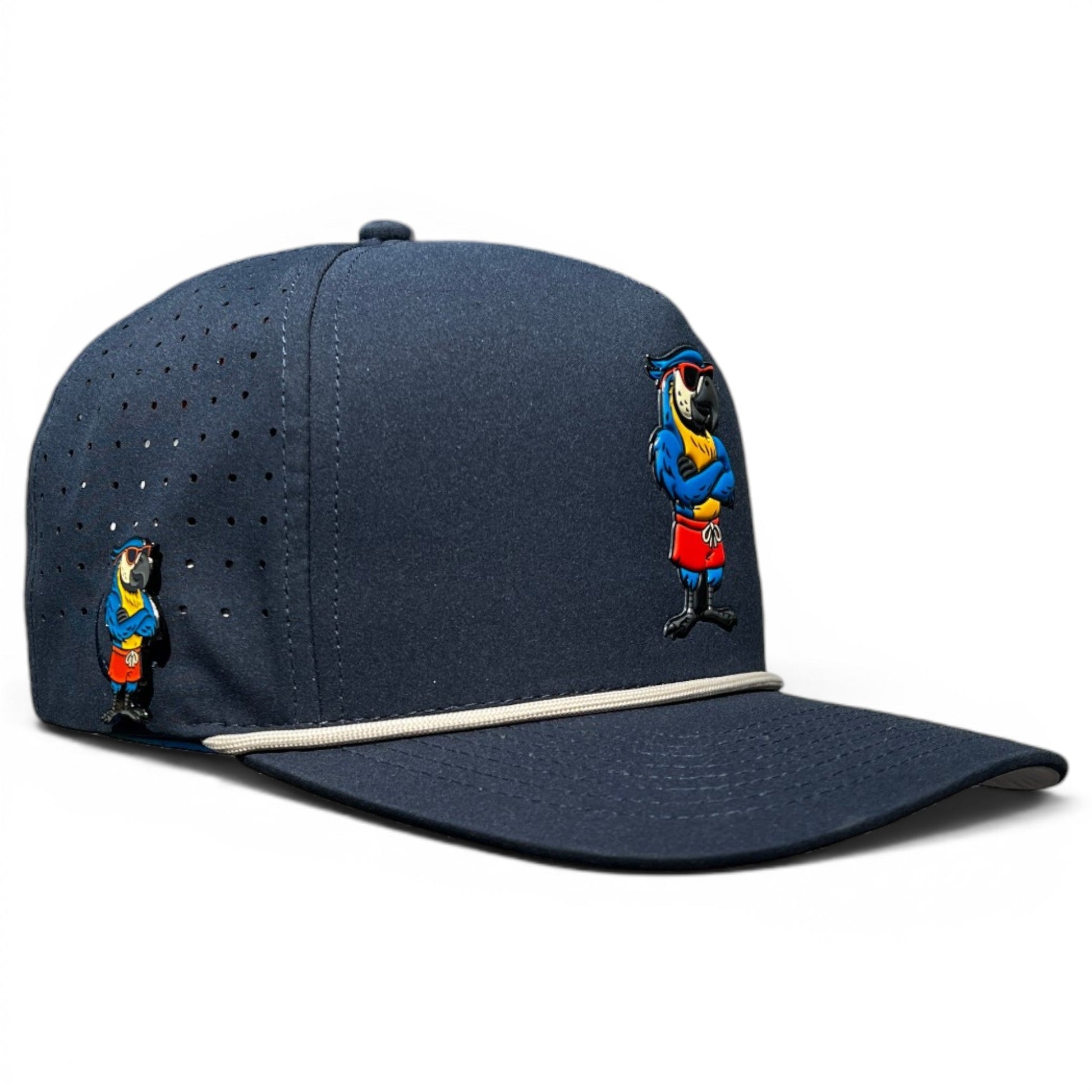 Logie Joe's Golf Parrot Patrol Golf Hat is an adjustable navy snapback cap featuring cartoon parrots, a white accent stripe, ventilation holes, and a built-in magnetic ball marker holder with marker included.