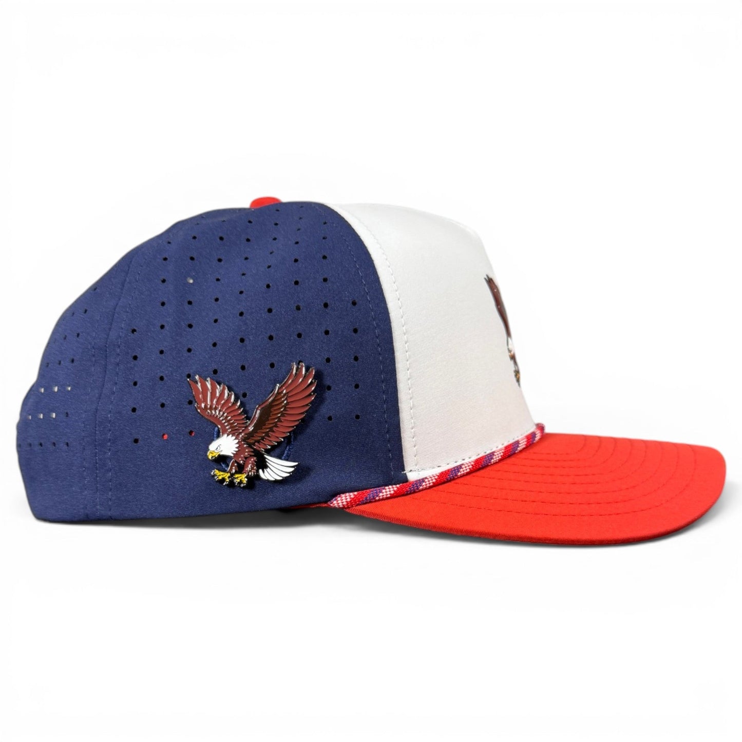 Show your American spirit on and off the golf course with Logie Joe’s Golf Freedom Flight Snapback Cap—an adjustable red, white, and blue hat featuring a perforated design for breathability, braided red-white trim, an eagle pin on the side, plus a convenient built-in magnetic ball marker holder (marker included).