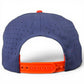 A rear view of the Logie Joe’s Golf Freedom Flight Golf Hat showcases its classic American style, featuring a navy blue design with a red adjustable snapback closure, small ventilation holes throughout the fabric, and a built-in magnetic ball marker holder with marker included—perfectly combining timeless golf hat appeal with practical innovation.